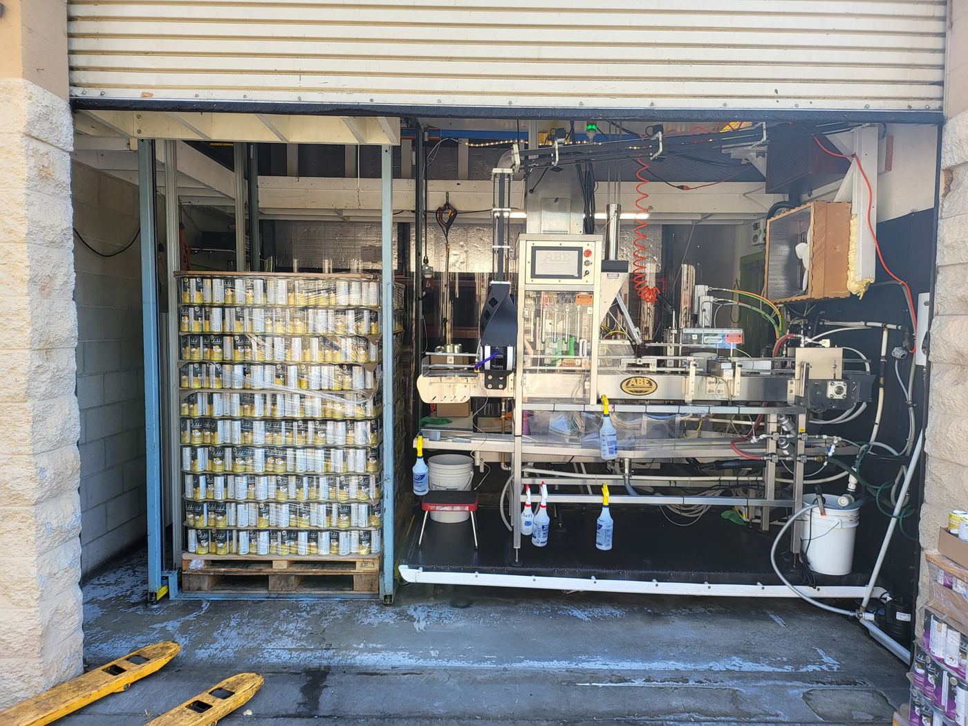 The finished depalletizer bay with a pallet of cans staged next to the line