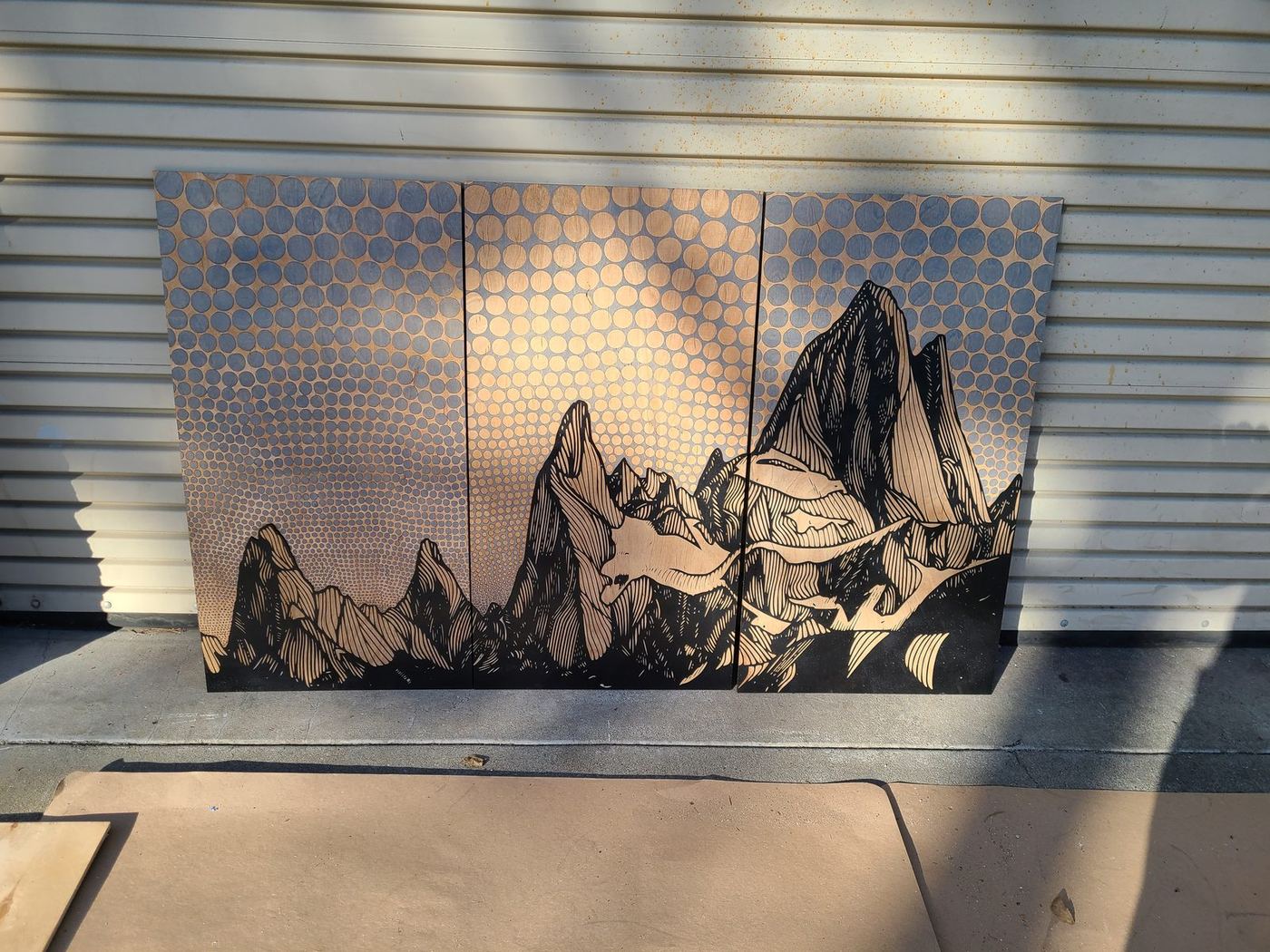 A triptych hung on the wall
