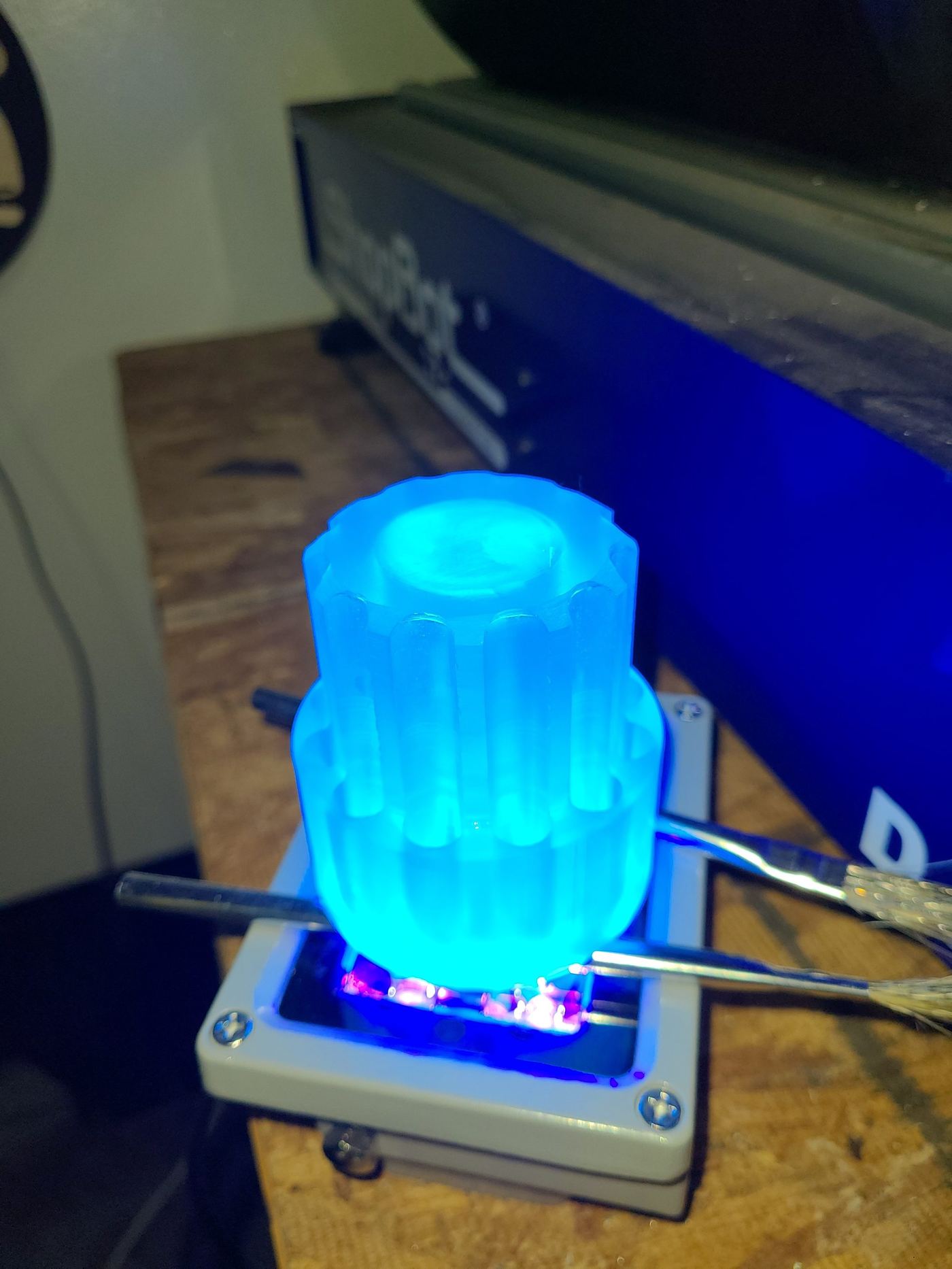 Resin 3D print glowing blue during curing