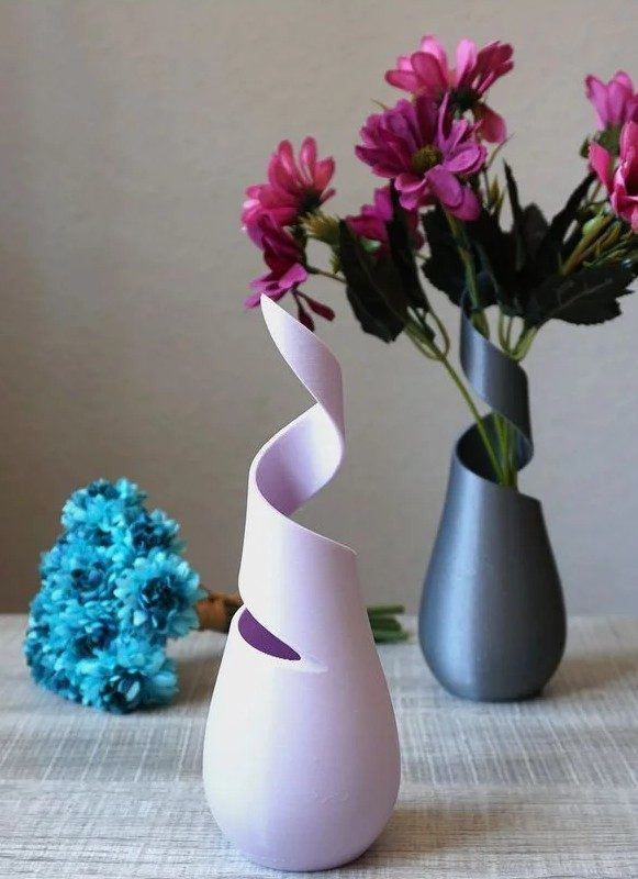 Finished 3D-printed twisted vase styled with flowers