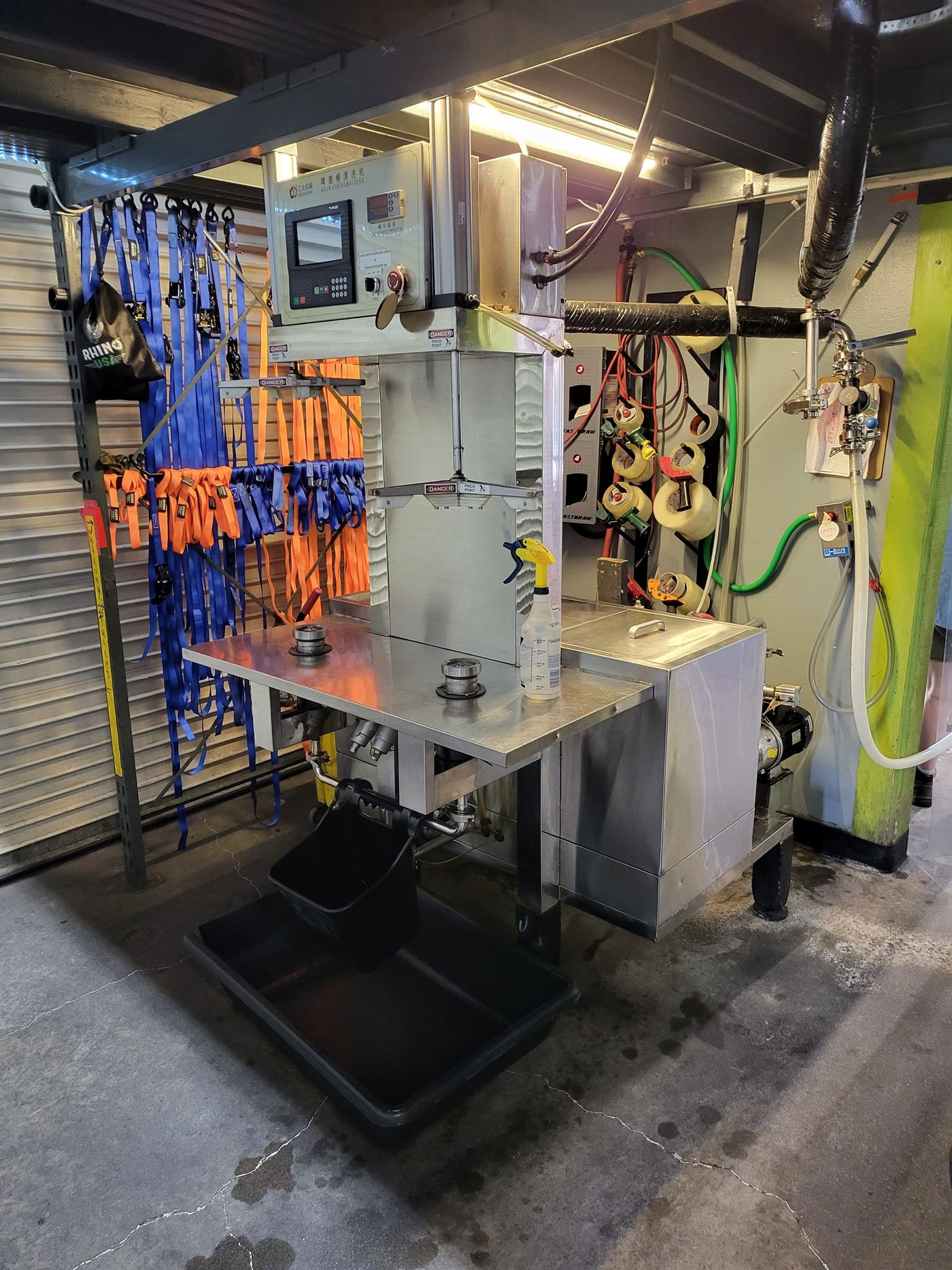 The rebuilt keg washer on its stand, with the glycol line and cleaning plumbing I ran to it overhead
