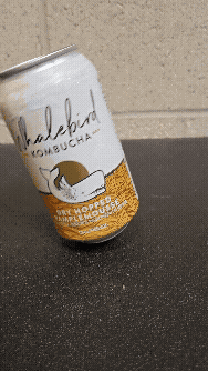 A Whalebird Kombucha can turning to show off its label design