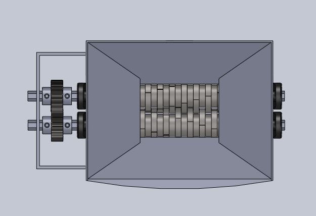 Top-down SolidWorks view of the grinder, showing the intermeshing cutting gears inside the hopper throat